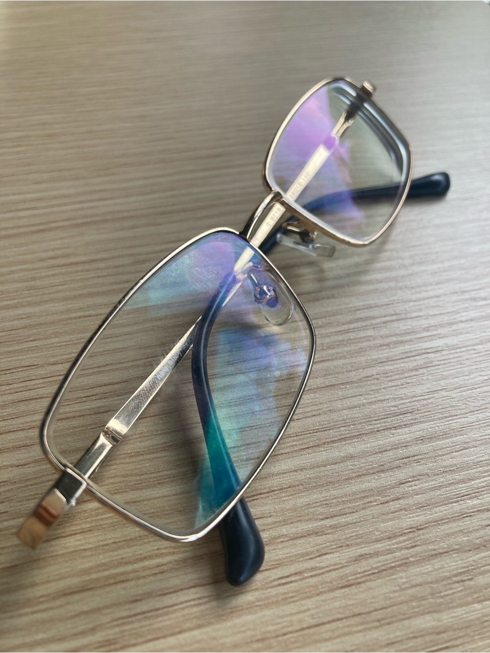 Gold Rim Rectangular Glasses with Blue Lens Reflection